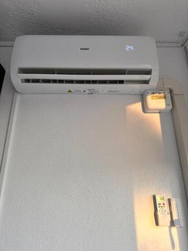 a refrigerator with a air conditioner in a room at A pie de PLAYA in La Pineda