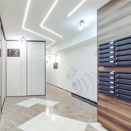 a walk in closet with a wall of drawers at OOTA Soko with Parking Garage in Kragujevac