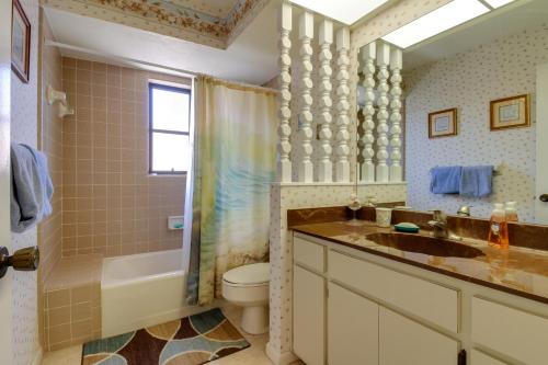 a bathroom with a sink and a toilet and a shower at The Marco Mariner in Marco Island