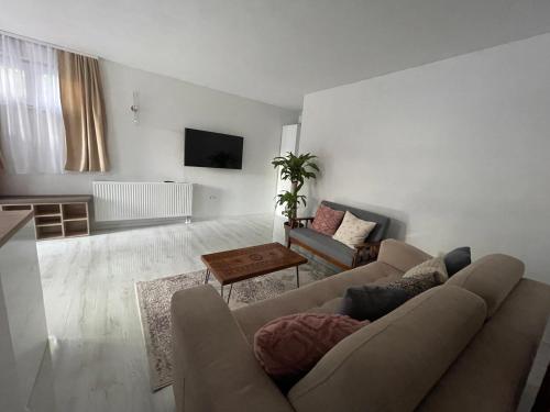a living room with a couch and a table at Apartment Herceg Blagaj in Blagaj