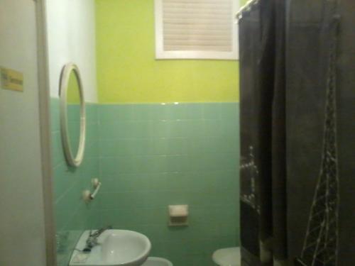 a bathroom with a sink and a mirror at Pensión Gema in Irún