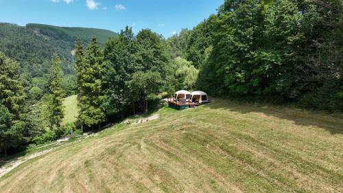 an open field with a gazebo on top of it at Glamping Rožnov in Rožnov pod Radhoštěm