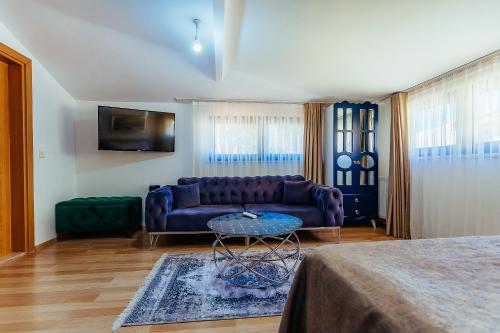 a living room with a couch and a table at Taksim Wonder Suites in Istanbul