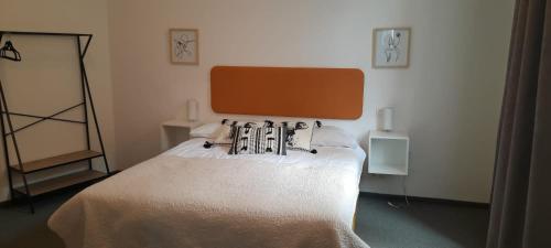 a bedroom with a white bed in a room at Apartments DOLAC Zagreb in Zagreb