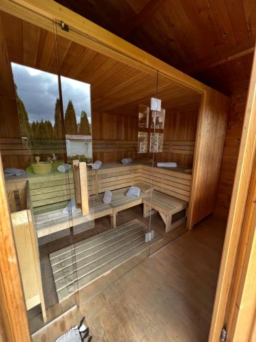 an inside view of a sauna in a wooden cabin at Cabana Dzsesszika&Erik in Kàszonuifalù