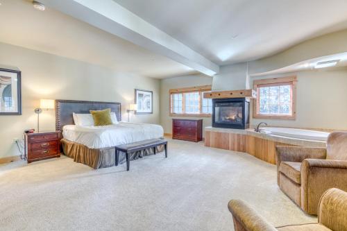 a bedroom with a bed and a bath tub at #201 Grand Lodge South Master Suite in Government Camp