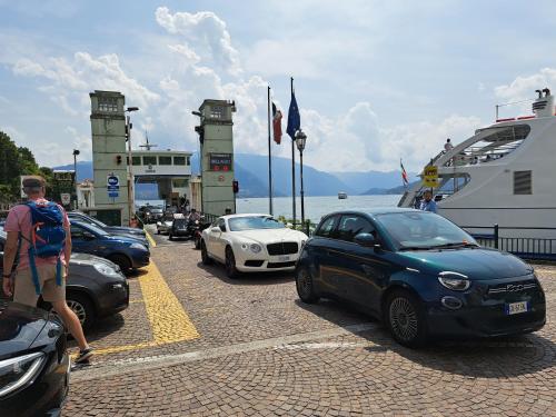 a group of cars are parked on a ferry at LA CASA DI MARIO in Perledo