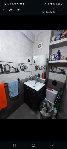a bathroom with a sink and a toilet at راحتي 2 in Tangier