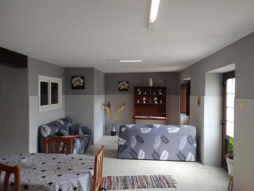 a living room with a table and a couch at Casa Lola in Oia