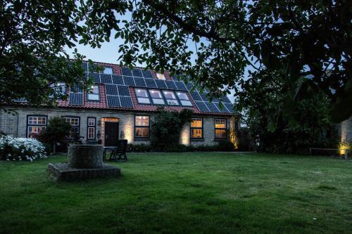 a house with solar panels on the roof at Haus im Felde Whg 5 in Fehmarn