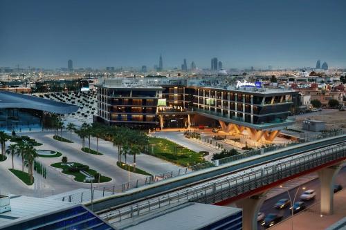 a view of a city with buildings and a bridge at Radisson Blu Hotel Riyadh Convention and Exhibition Center in Riyadh