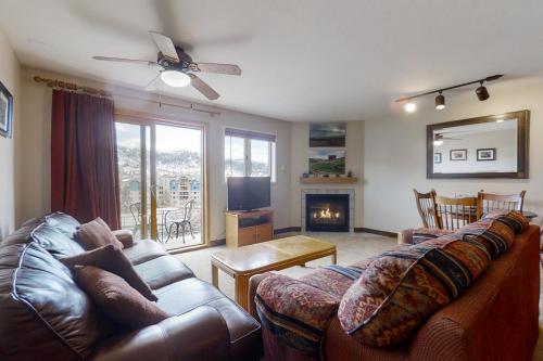 a living room with a couch and a fireplace at The West 3507 in Steamboat Springs