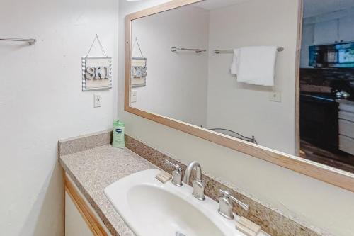 a bathroom with a sink and a mirror at Iron Horse Resort D3084 in Winter Park