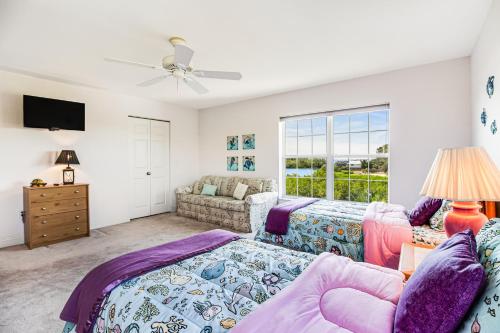 a bedroom with a bed and a couch at Bayshore Panorama in Bradenton