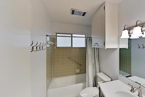 a bathroom with a shower and a toilet and a sink at Rockport Beach Club East & West in Rockport