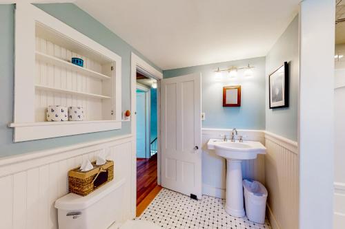 a bathroom with a sink and a toilet at Full of Light Cottage in Rockland