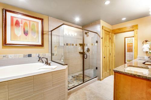 a bathroom with a shower and a tub and a sink at Trailhead Lodge #108 in Cle Elum