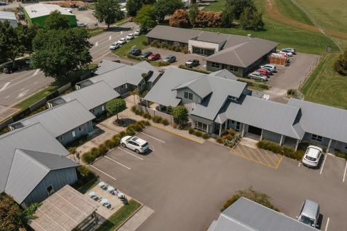 an aerial view of a residential neighbourhood with houses at South Street West Motel in Feilding