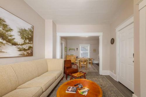 a living room with a couch and a table at Historic 2 KING BED 1 Bath Near Downtown Spokane in Spokane