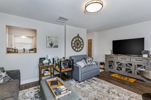 a living room with a couch and a flat screen tv at 1062 Riverfront in Nashville