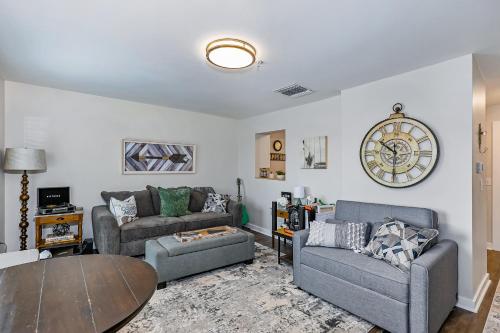 a living room with two couches and a table at 1062 Riverfront in Nashville