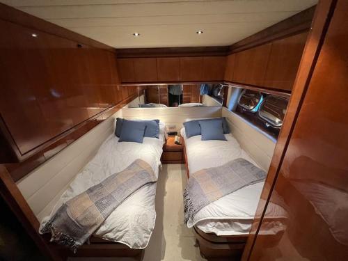 two beds in the back of a boat at Sleep Under the Stars. in Villeneuve-Loubet