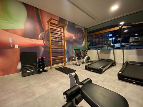 a gym with two treadmills and a treadmill at Mana Beach Ohana 208 in Ipojuca