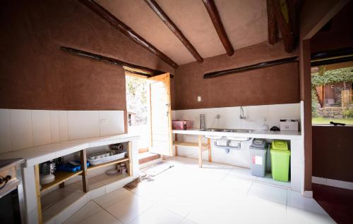 a kitchen with a sink and a counter top at Rumi Lodge Pisac in Pisac