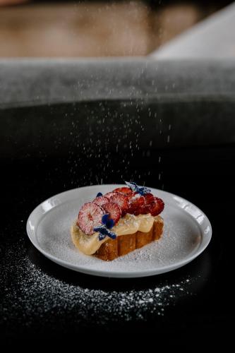 a piece of food on a plate on a table at Moss Manor in Moss Vale