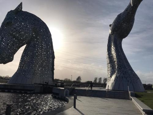 a statue of two horse statues next to a body of water at Scardroy Falkirk - 3 Bedroom Apartment in Falkirk