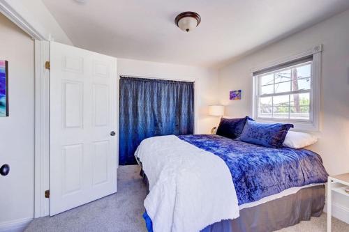 a bedroom with a bed and a window at Victorian Manor 1 mile from Downtown Denver! in Denver