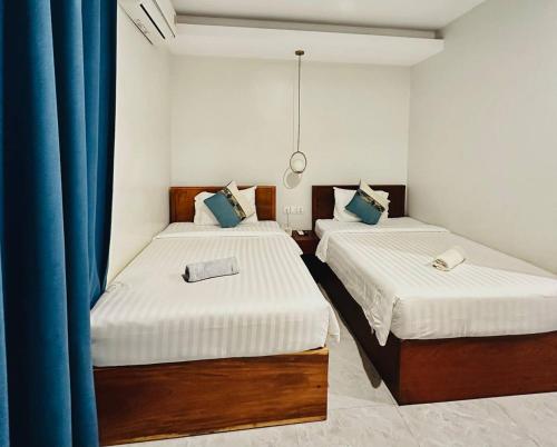 Postel nebo postele na pokoji v ubytování Laluna Guesthouse