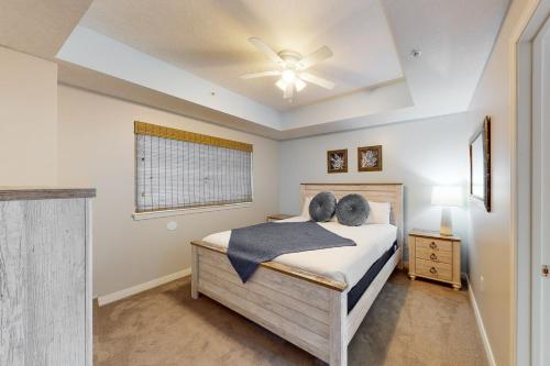 a bedroom with a bed and a ceiling fan at Destin West Resort - Gulfside 207 in Fort Walton Beach