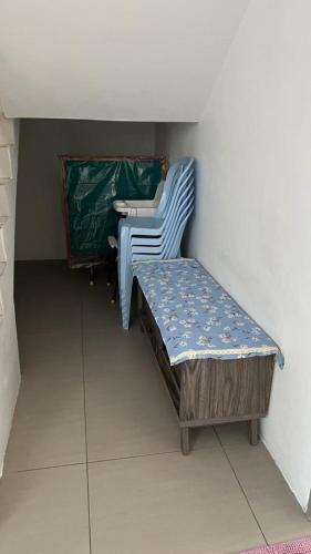 a small room with a bed and a sink at Sweet Homestay 3RM @ Penthouse Apartment in Brinchang in Brinchang