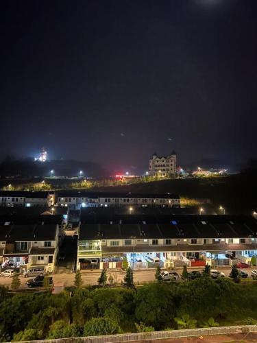 a city at night with buildings and lights at Sweet Homestay 3RM @ Penthouse Apartment in Brinchang in Brinchang