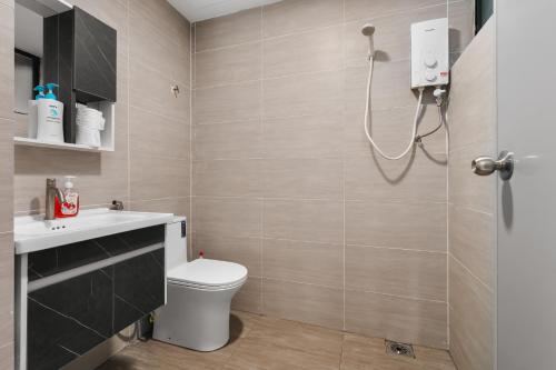 a bathroom with a toilet and a shower at Bukit Bintang Times Sq With 3 Bedroom 74 in Kuala Lumpur