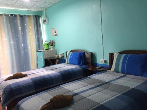 Katil atau katil-katil dalam bilik di Tassana House