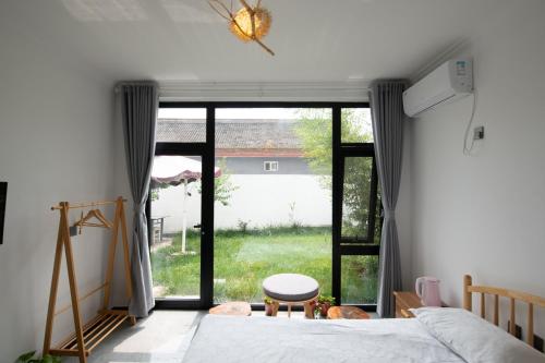 Postel nebo postele na pokoji v ubytování Creek Tang B&B