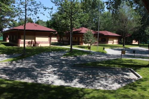 a park with a building and a pavilion at Tourist Resort Ribarsko Ostrvo in Novi Sad