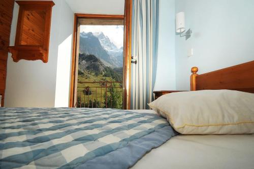 Postel nebo postele na pokoji v ubytování Appartement 10 couchages face à la meije