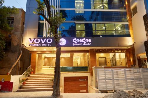a building with a voxo sign in front of it at VOVO PREMIER HOTEL in Bengaluru
