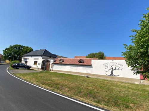 a building with a tree painted on the side of it at SECRET GARDEN LKÁŇ 