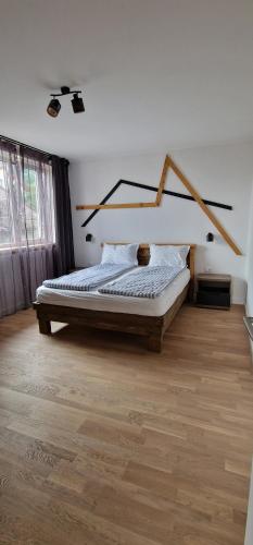 a bedroom with a bed in a room at Central apartment with city view in Braşov