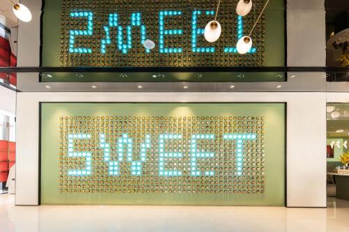 a sign for a store with the word spring on it at Keypai Hotel Free Shuttle Bus to Canton Fair in Guangzhou