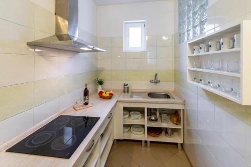 a kitchen with a sink and a counter top at Penzión Brest Habovka in Habovka