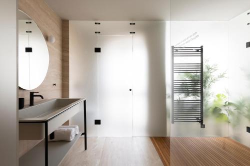 a bathroom with a sink and a mirror at Gozo Harbour Views, Mgarr Heights in Mġarr