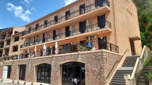 a building with balconies on the side of it at Le Vaita in Porto Ota