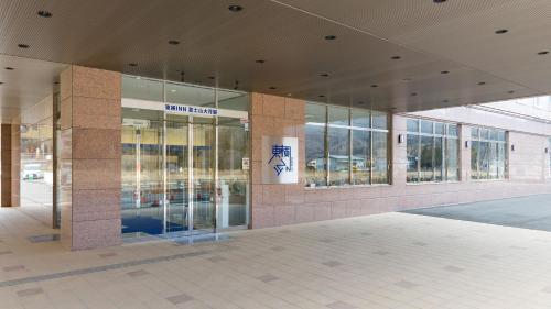 a building with a lobby with glass doors at Toyoko Inn Fujisan Otsuki-eki in Ōtsuki
