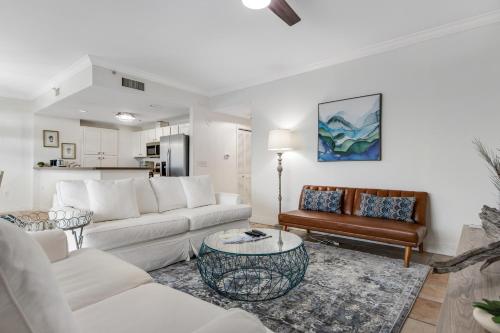 a living room with a couch and a table at South Harbour 07B in Pensacola Beach