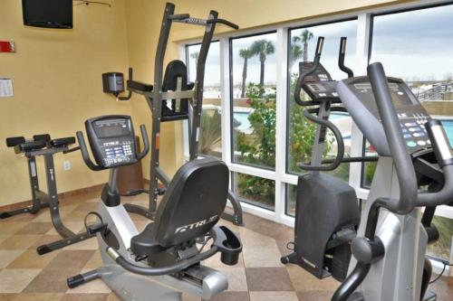 a gym with two exercise bikes and a cell phone at Emerald Isle 0603 in Pensacola Beach